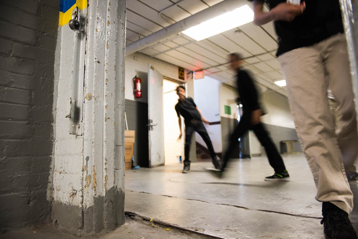 The hallway that connects Dickinson West Elementary School with Kosciuszko Middle School reveals the marks of decay.
