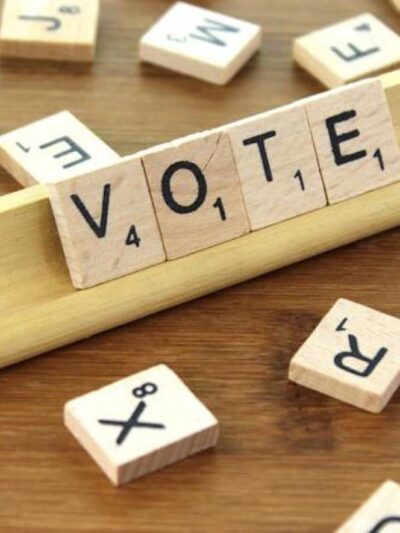 Scrabble tiles that read "Vote"