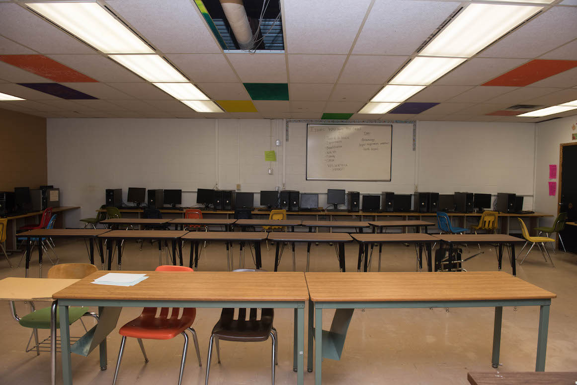 One of the school's computer labs--a large room with no windows, the problem is not the shortage of computers purchased with federal grant money. The issue is a hot climate.