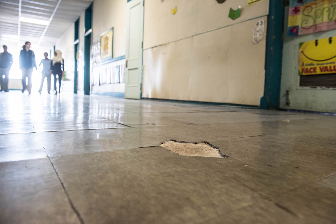 High-traffic tile floors are crumbling at Dickinson East Elementary.