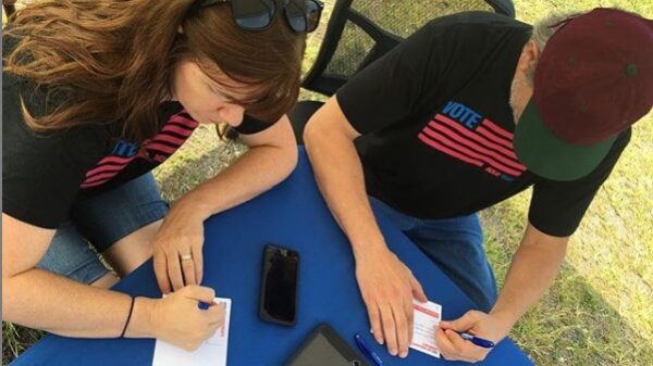 people signing up to volunteer for petition drives