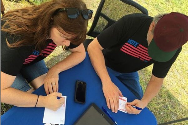 people signing up to volunteer for petition drives