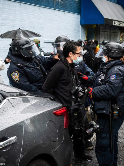 A photojournalist is arrested by NYPD officers during an anti-Trump protest in New York City