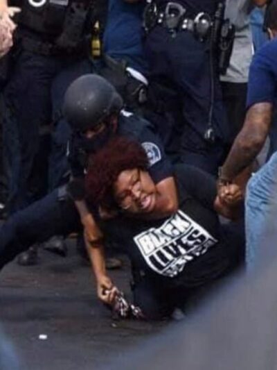 Protestor being handcuffed