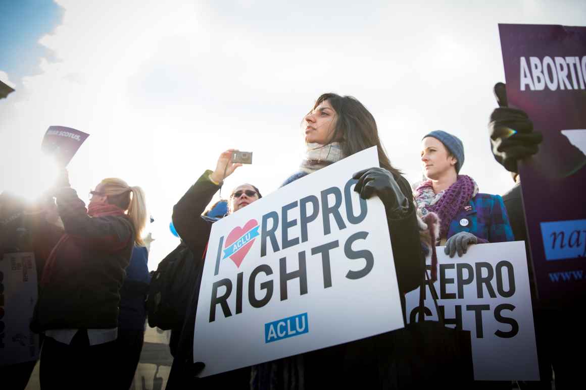 Activist protesting for reproductive rights at the Supreme Court
