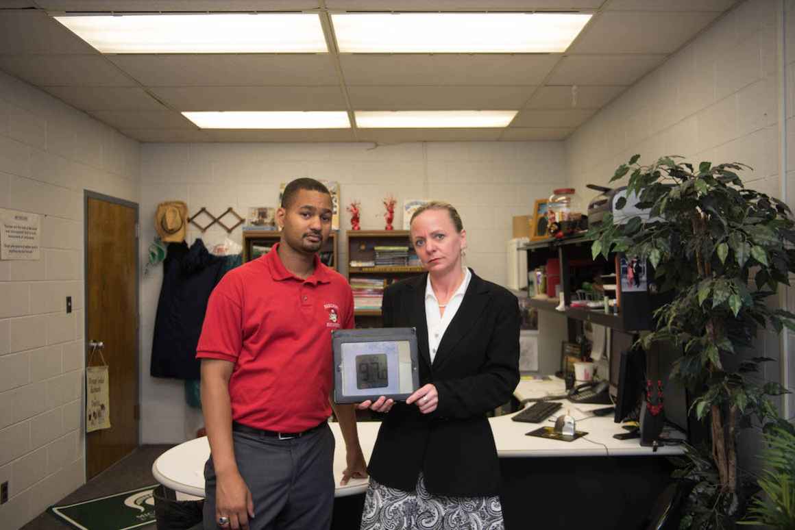 Principal Diana Castle, with Vice Principal Lance Sumpter, was so shocked on the day that her office thermometer read 97 degress, she took a picture.