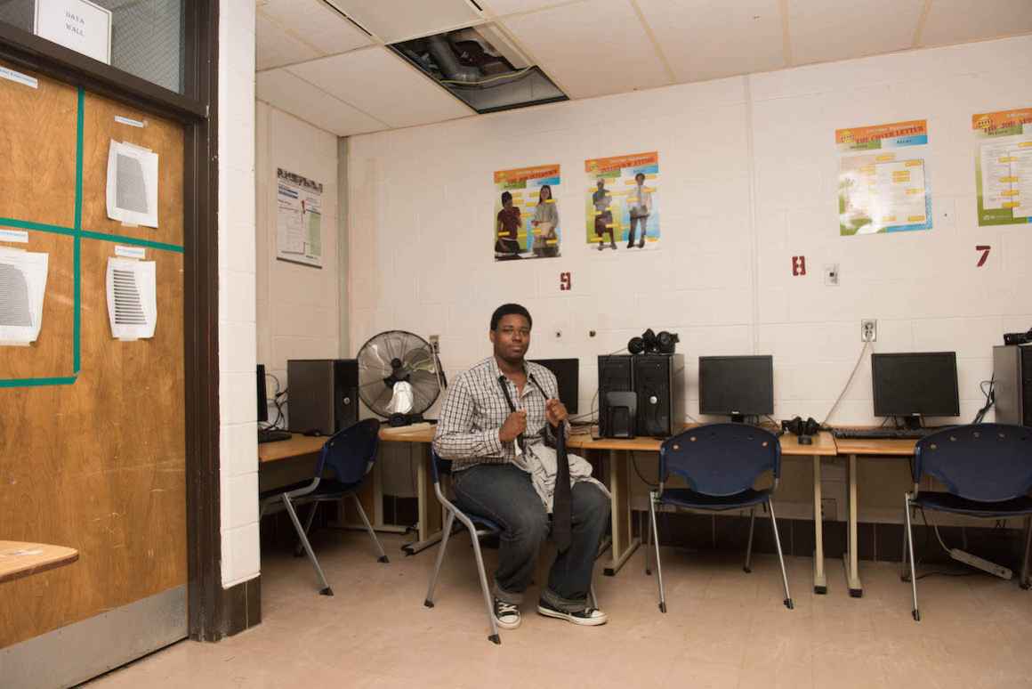 Beecher High Senior, Marcus Brown, sits in another computer lab. The temperature in the windowless classroom can soar well above 90 degrees on some days.