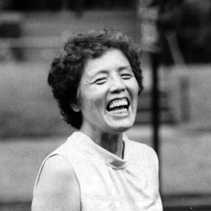 Black and white image of activist Grace Lee Boggs laughing