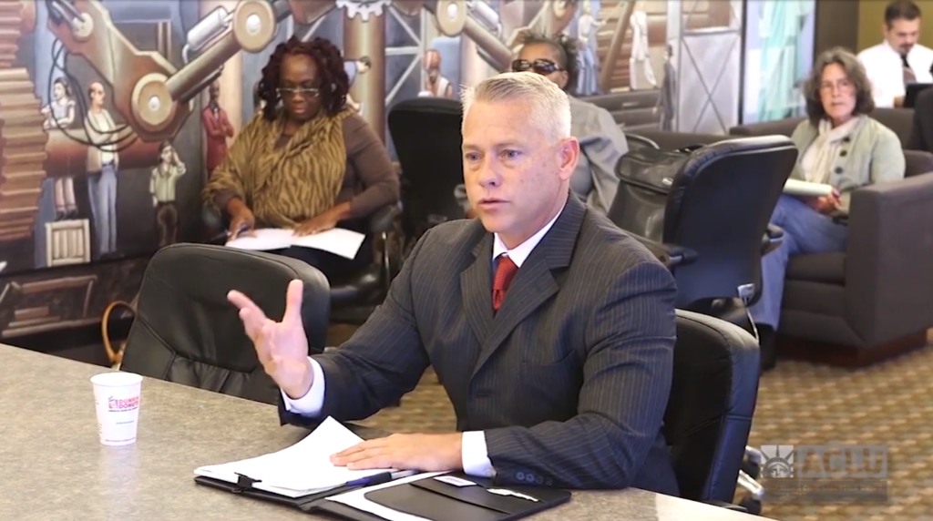 Former Kalamazoo Police Chief Jeff Hadley, shown speaking at an ACLU of Michigan public hearing on policing, led efforts to address racial bias among police that received national recognition.