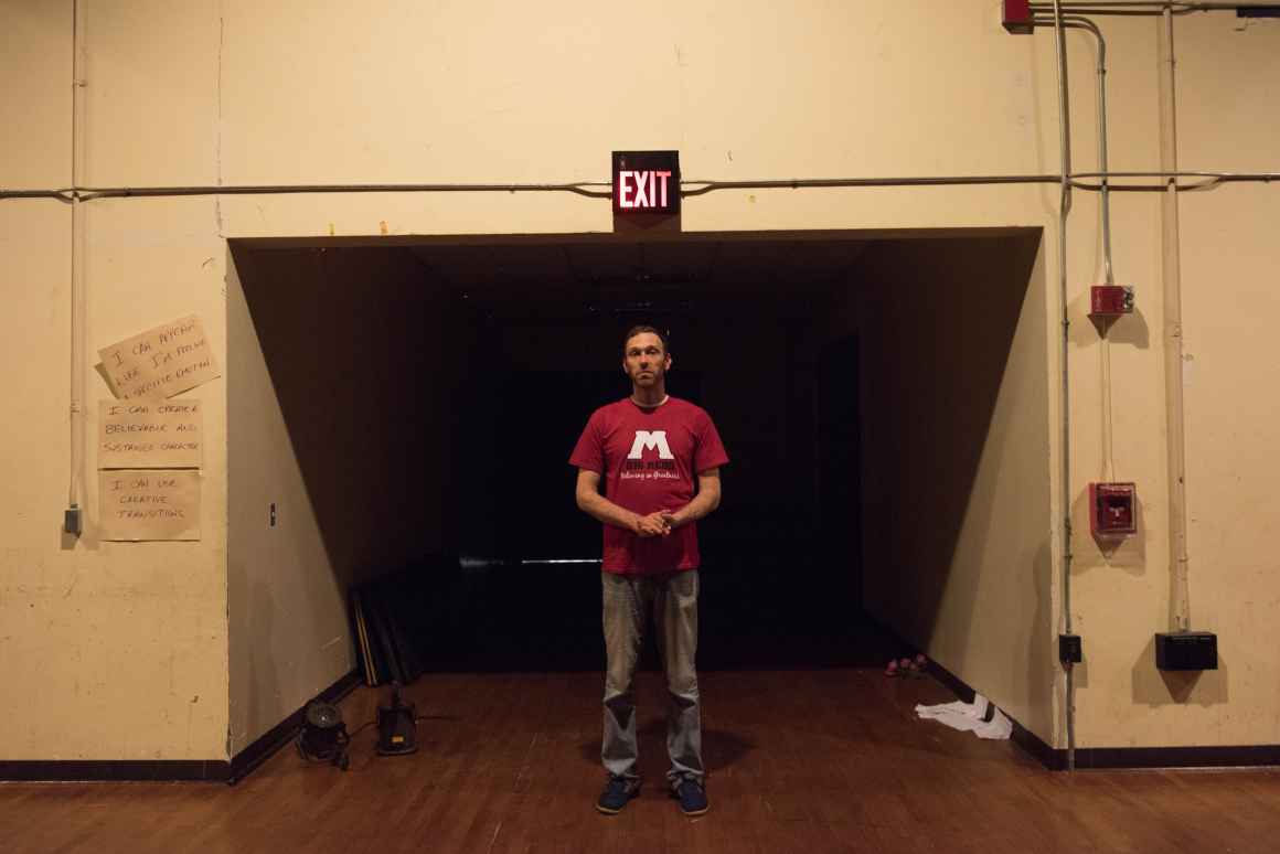 Kirk Carlson, graduate of Muskegon High School and now the school's theater teacher and stage manager, stands at the entrance to the outdated auditorium--which desperately needs new lighting but is burdened by an antiquated system that cannot accommodate 