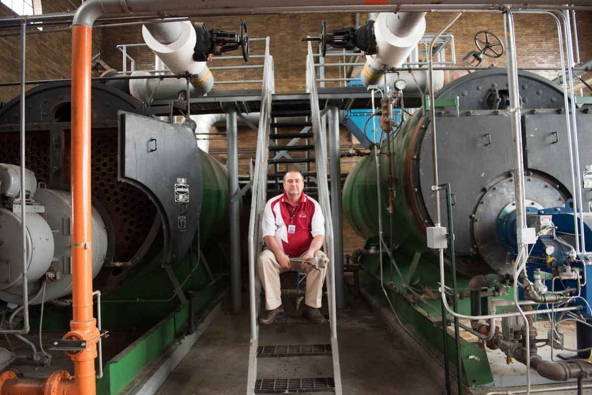 Buildings and Maintenence Director, Sam Witheiss in the schools old, but operational boiler room.