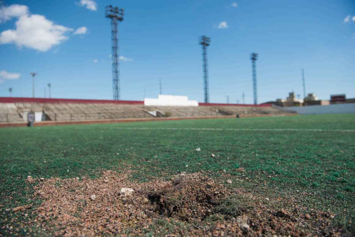 Holes and ripped seams pock the playing field shared by schools in the Hamtramck Public Schools district.