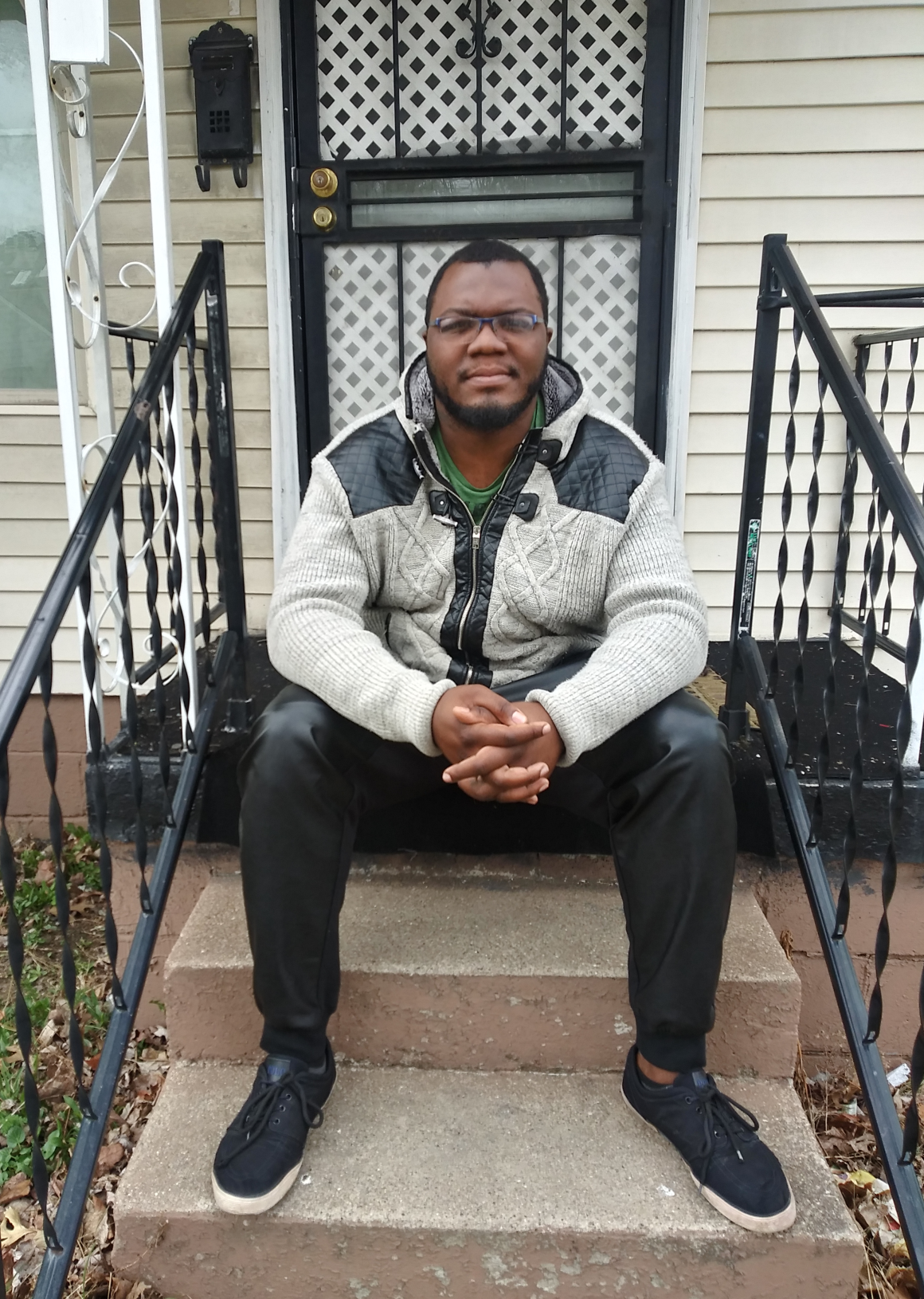 Richard Griffin sitting on front steps