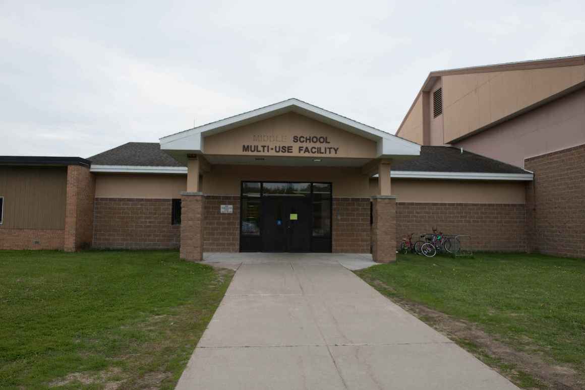 Damaged signage welcomes arrivals to the single K-12 building in Rudyard where the more than 800 students are educated. The building also houses the district’s administrative offices.