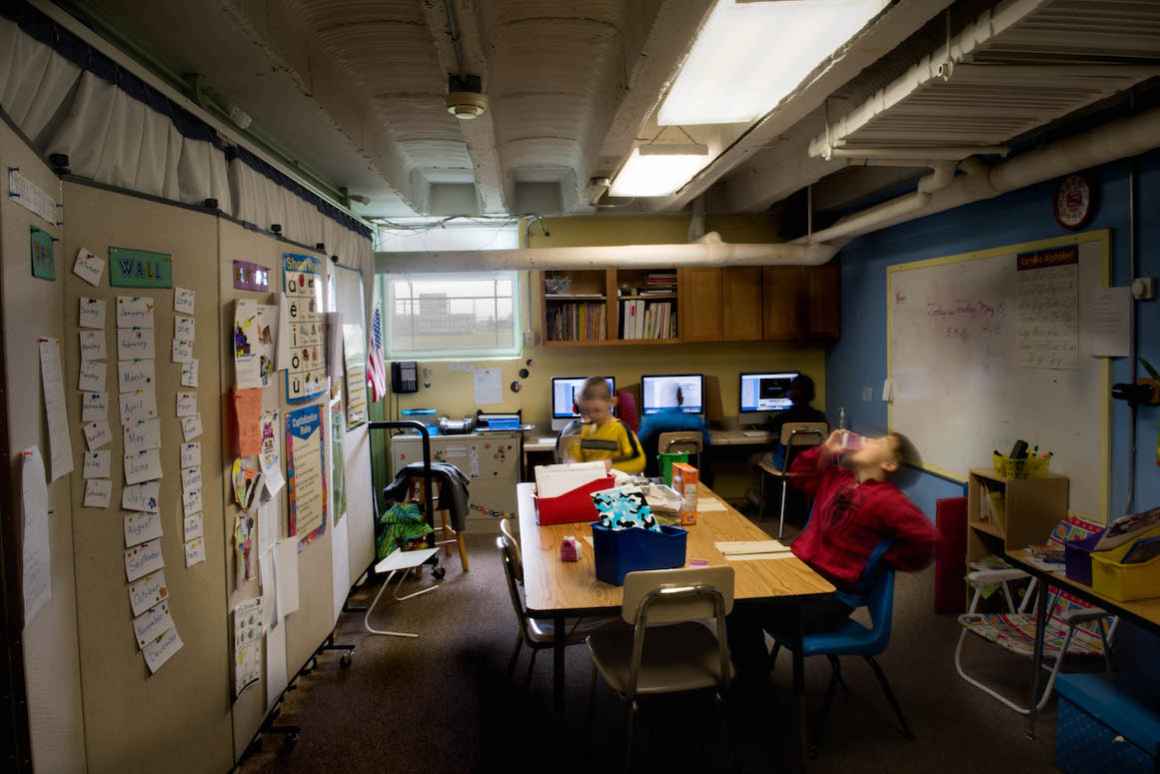 Special-education students in Sodus Township District #5 learn behind a temporary partition that demarcates a small classroom set up on a stage at the school. The classroom must be dismantled and reassembled each time the school uses the stage for a produ