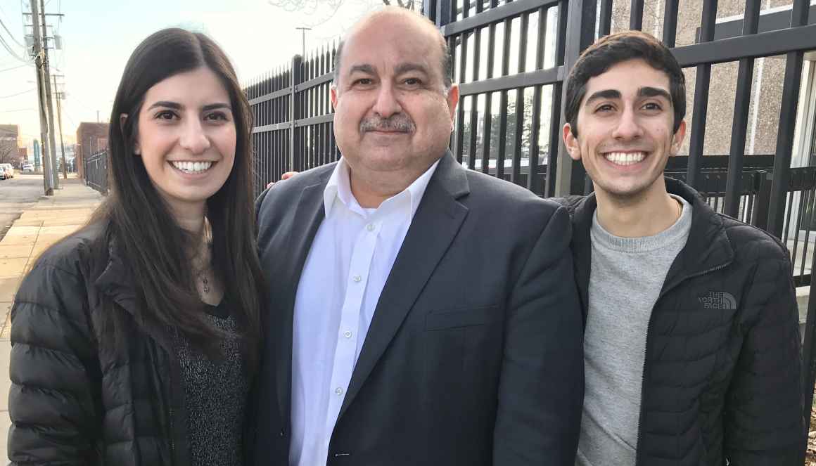 Sam, Brittany and Chris Hamama standing together in Detroit