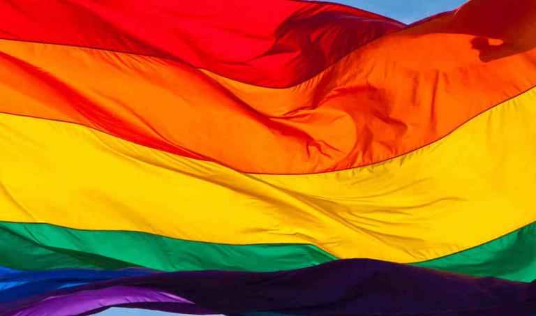 Flag waving with rainbow colors